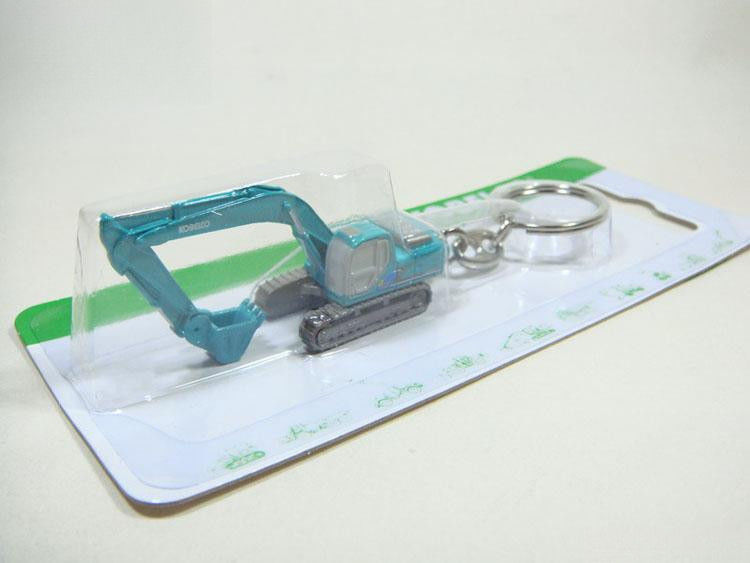Authentische Schlüsselkette für Bagger mit doppelter Funktion Sammlergeschenk 2,8 cm realistisches Design